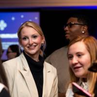 Grads smile and talk at Toast